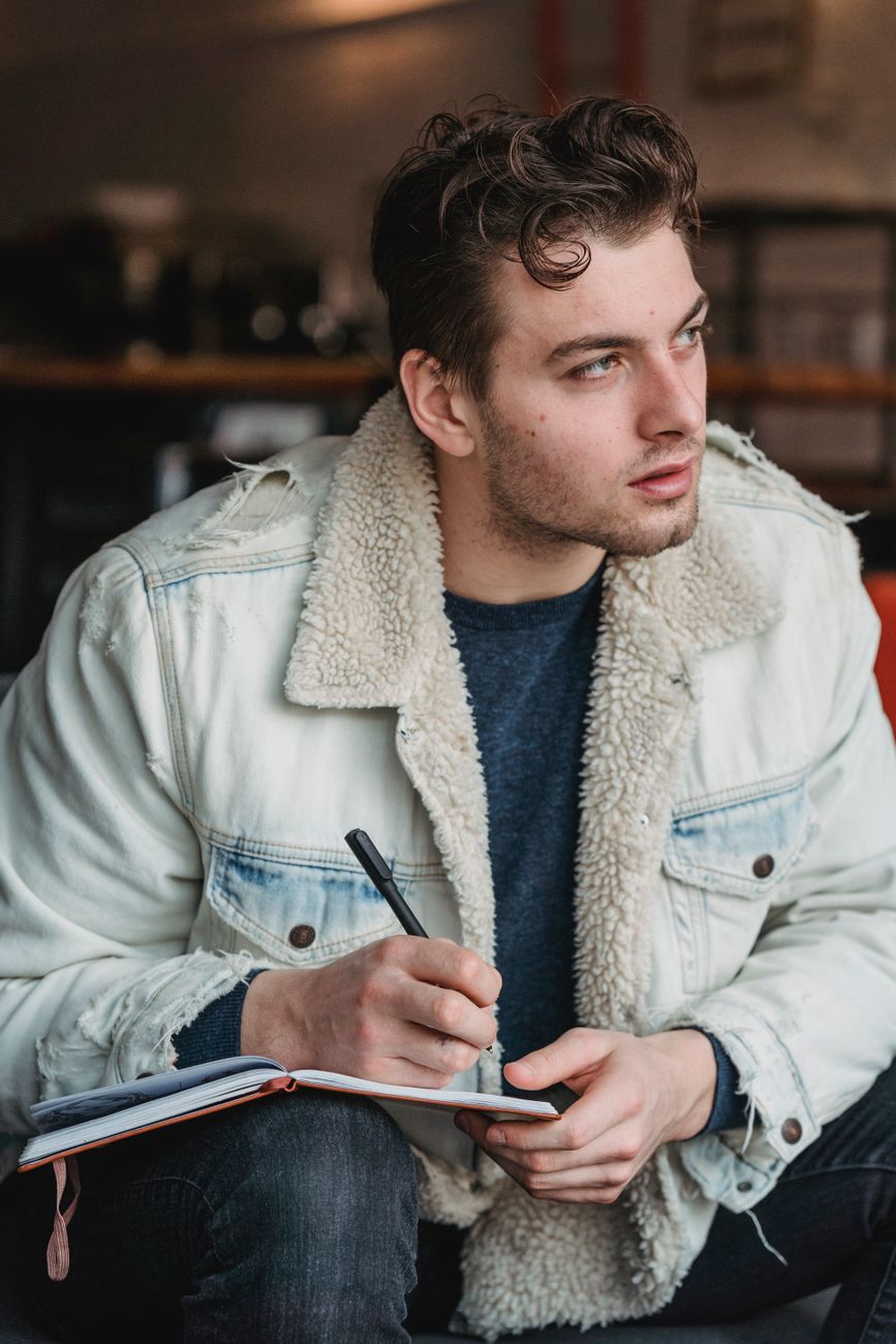 Travel writer taking notes in a rustic cafe